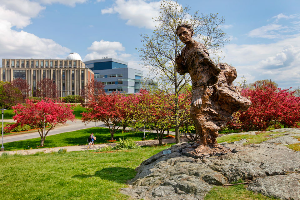 Louis Brandeis statue with red trees in background