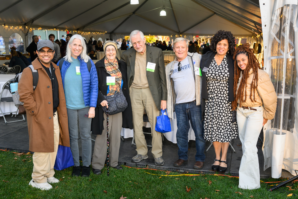 Families gathered outside of a tent at family weekend