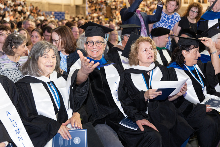 50th reunion attendees in caps and gowns at commencement