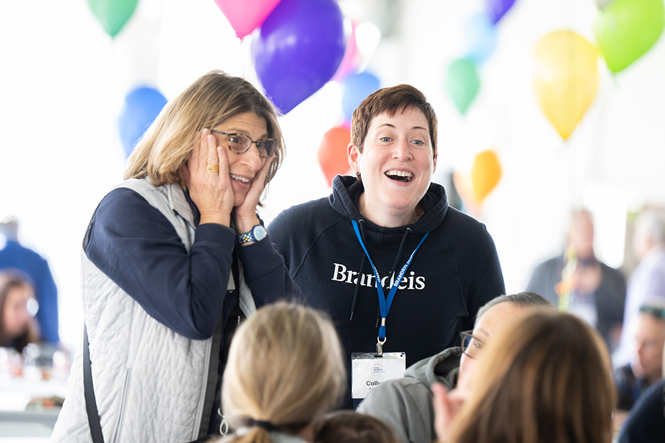 two excited happy alumni 