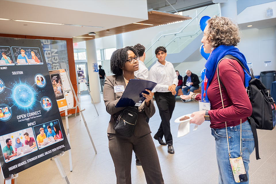 student surveying an alum