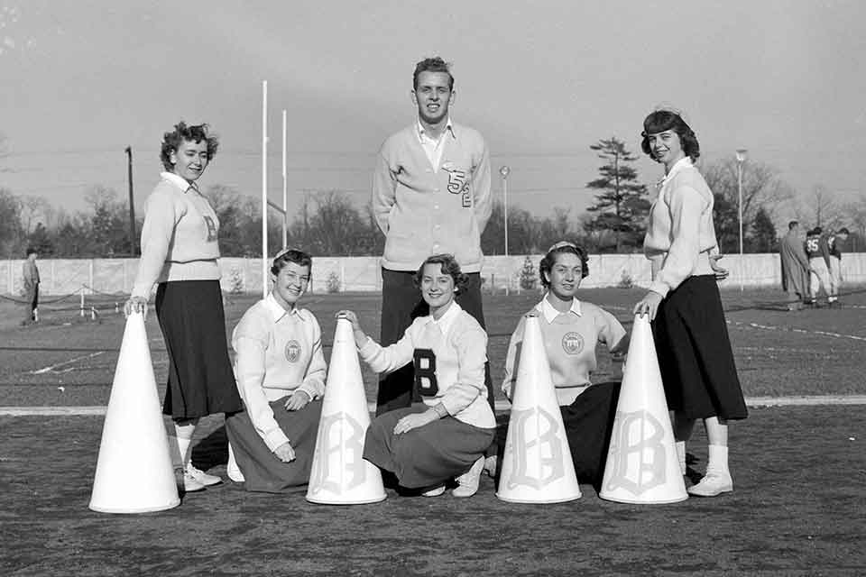 Group of cheerleaders posing in formation 