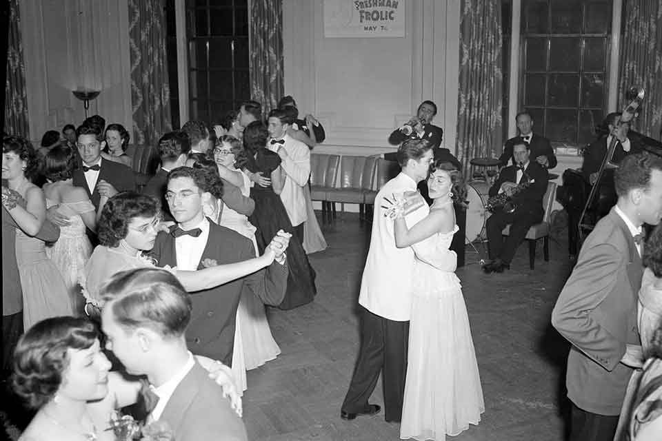 Students in formal attire dancing at a Brandeis formal
