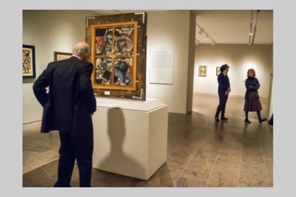 Leonard Lauder looking at a cubist painting 