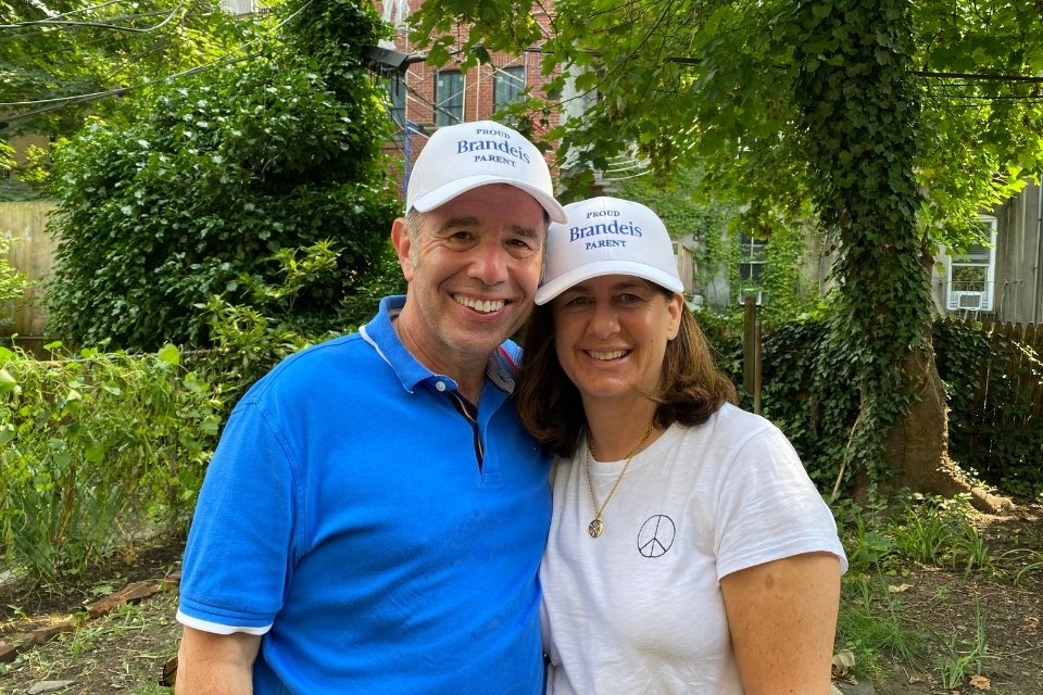 Marlene and Mark Fischer wearing proud Brandeis parents hats