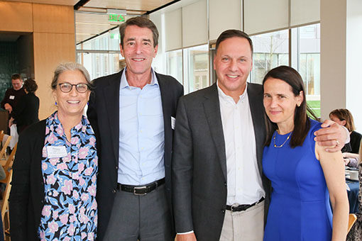 Two parents standing with Ron and Jessica Liebowitz