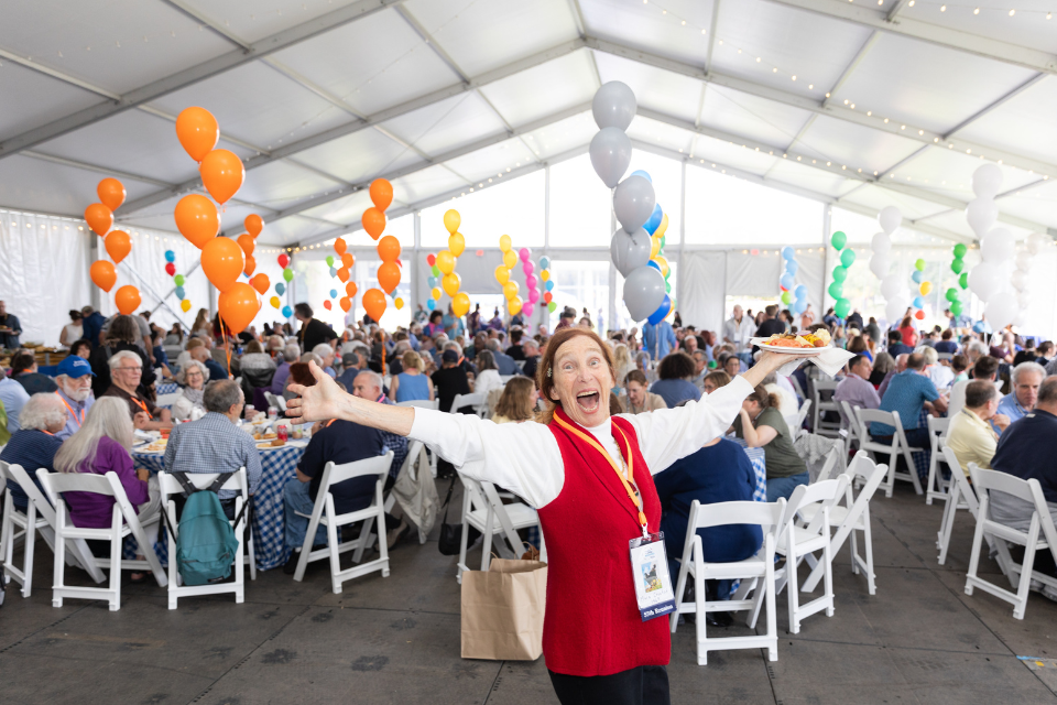 one brandeis alumni enjoying the ralph norman bbq