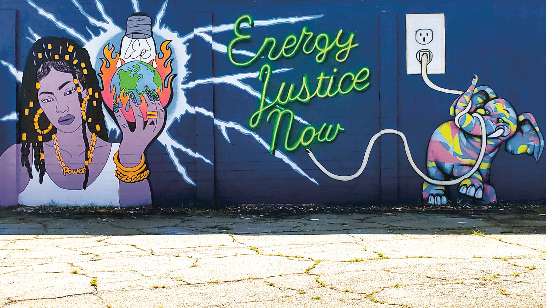 Painted mural that says "Energy Justice Now" 