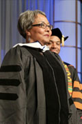 alumna wearing commencement regalia