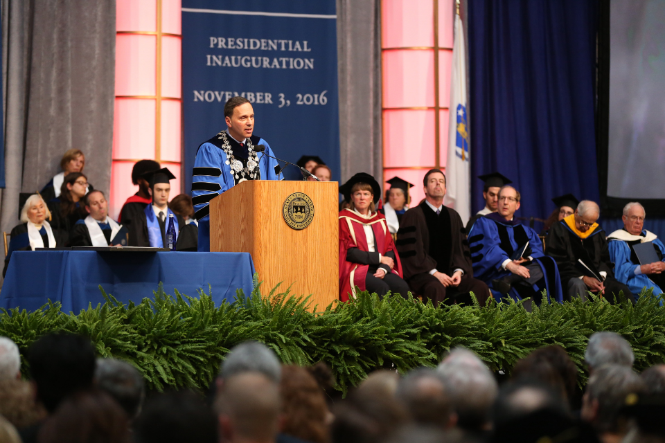 Ron Liebowitz speaks to a crowd at a podium