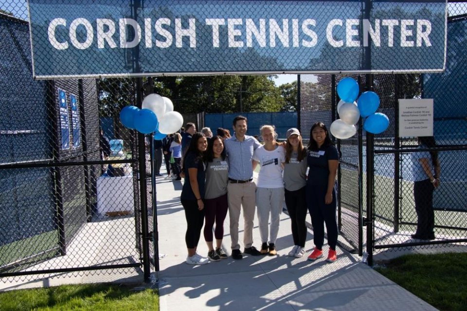 Jonathan Cordish poses with students at Cordish Tennis Center dedication