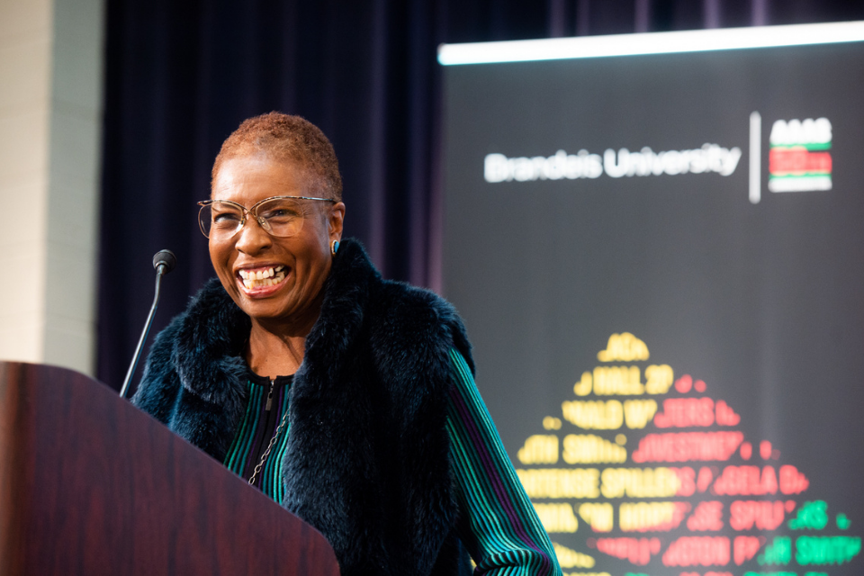 Hortense J. Spillers grins widely at a Brandeis podium