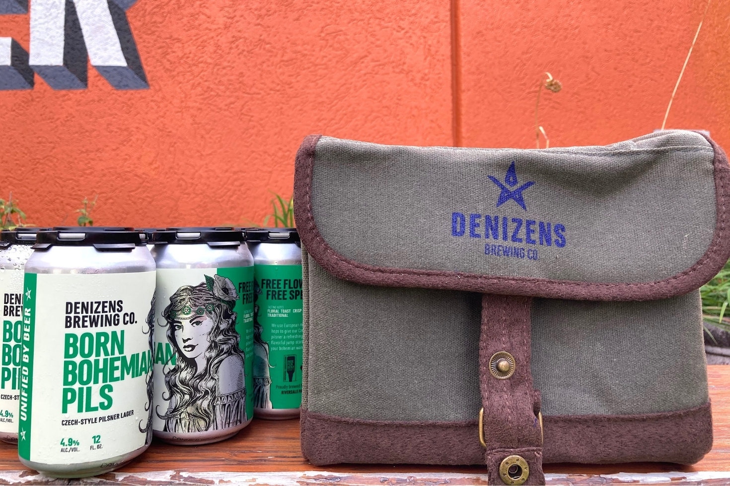 Cans of beer next to a canvas bag