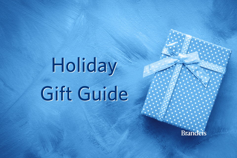 Blue gift box with text that reads "Brandeis holiday gift guide"