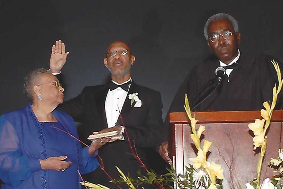 Otis Johnson being sworn in by a judge 