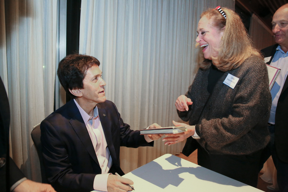 Mitch Albom signs books for fans at Brandeis.