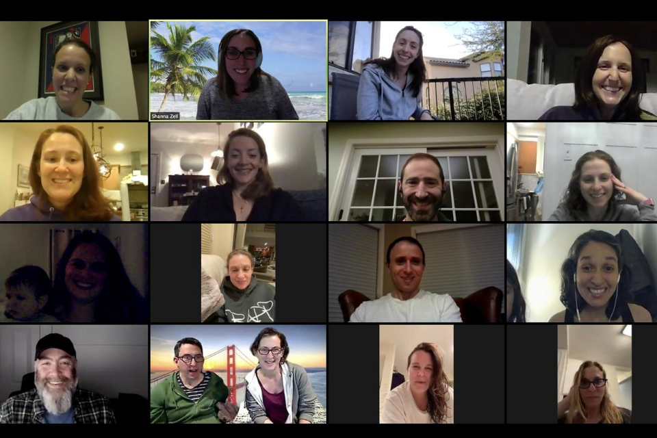screenshot of virtual alumni gathering via Zoom with tiles of smiling faces