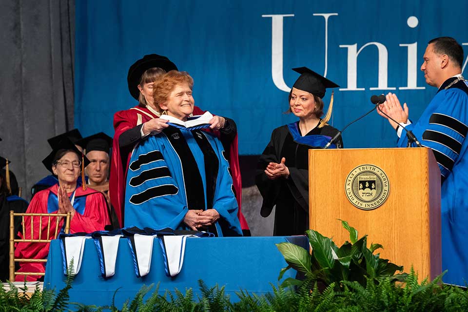 Deborah Lipstadt is hooded by Provost Lisa Lynch at the 2019 Commencement Ceremony