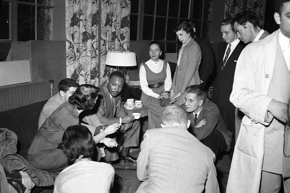 Dr. Martin Luther King Jr. having tea with students at Brandeis