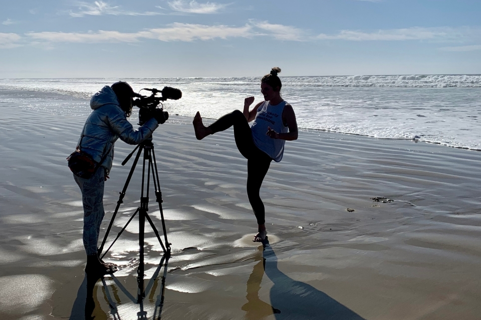 Elizabeth Cayouette shooting video on the beach.