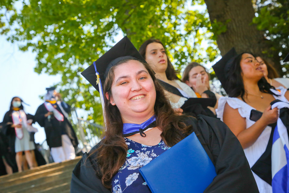 Smiling student in cap and gown