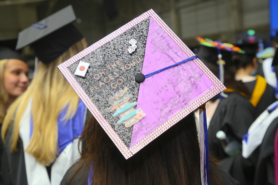 Mortarboard with map of Japan that says oh, the places you'll go.