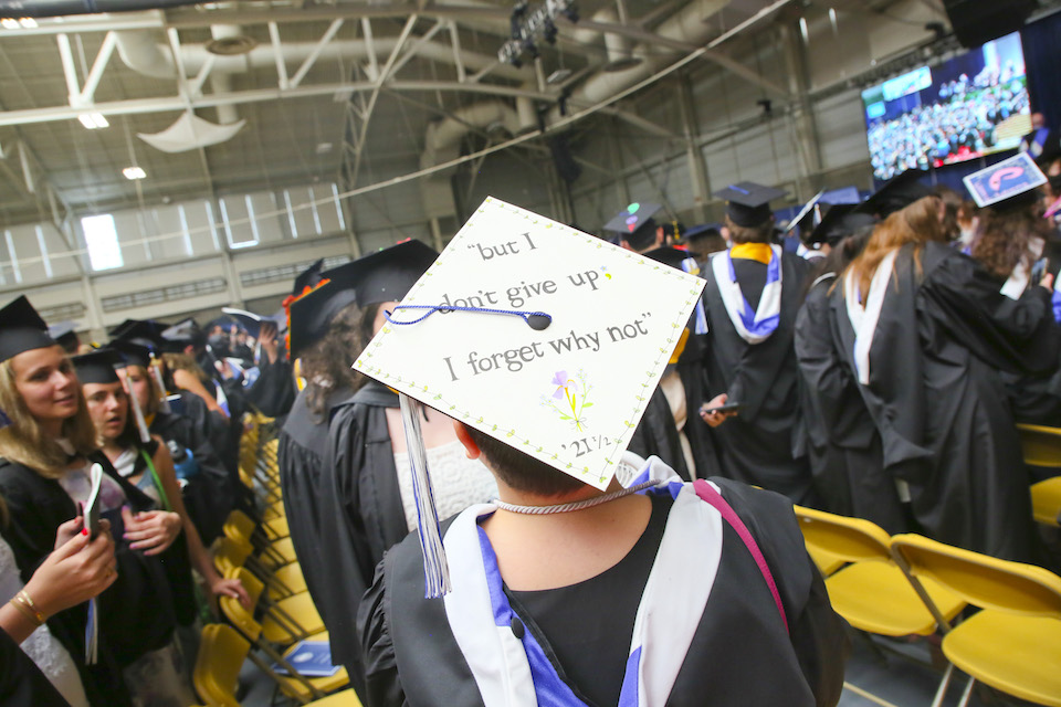 Mortarboard that says but don't give up; I forget why not