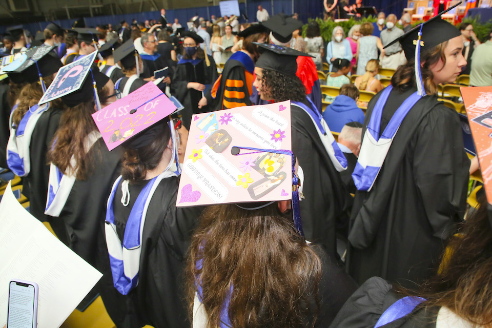 Two pink mortarboards