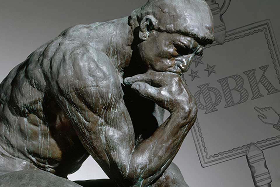sculpture of "The Thinker" with the Phi Beta Kappa logo in the background