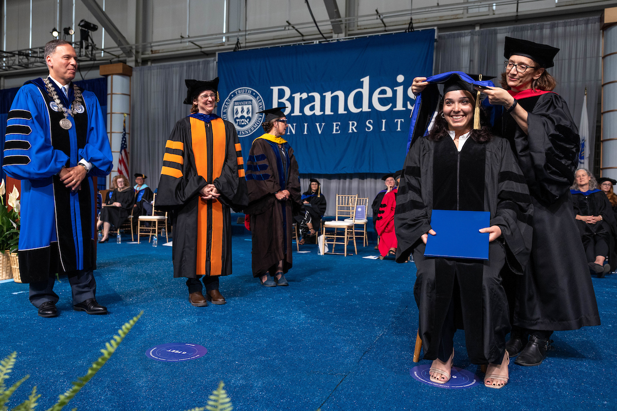 Francesca Capocasa, GSAS PhD ’23, is hooded for her Ph.D in physics during the event.