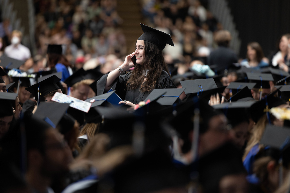 Bianca Kisin ’23 finds friends in the sea of graduates.