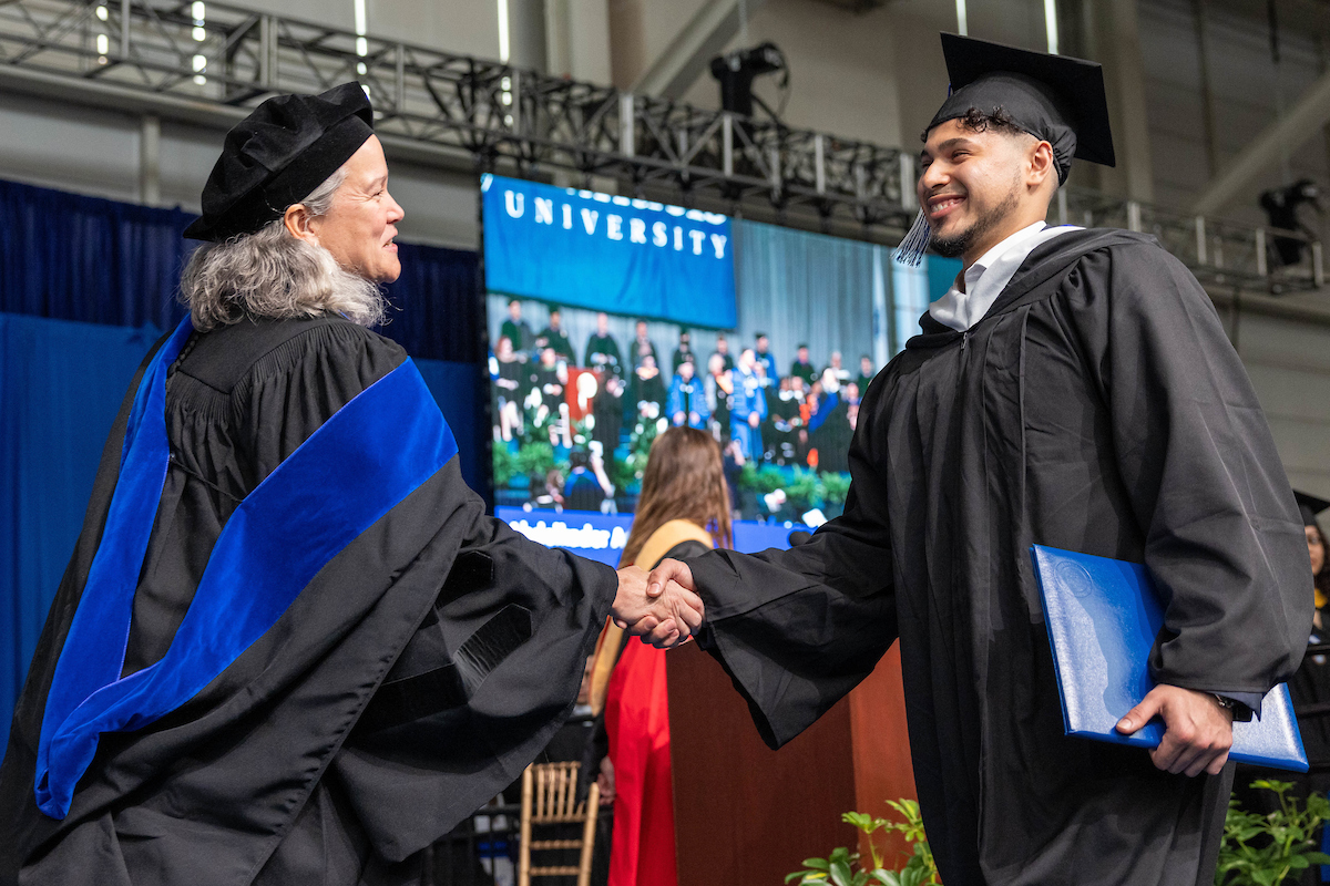 In a new addition to Commencement proceedings, students walked the stage to be greeted by Dean Dorothy Hodgson and President Liebowitz.