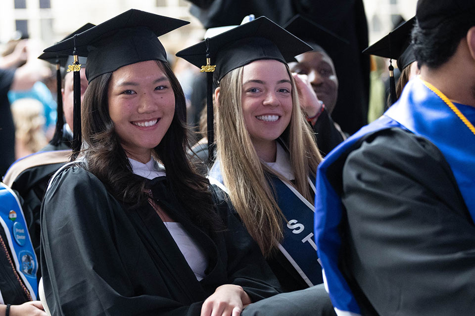 Students from the Brandeis International Business School celebrate at Commencement
