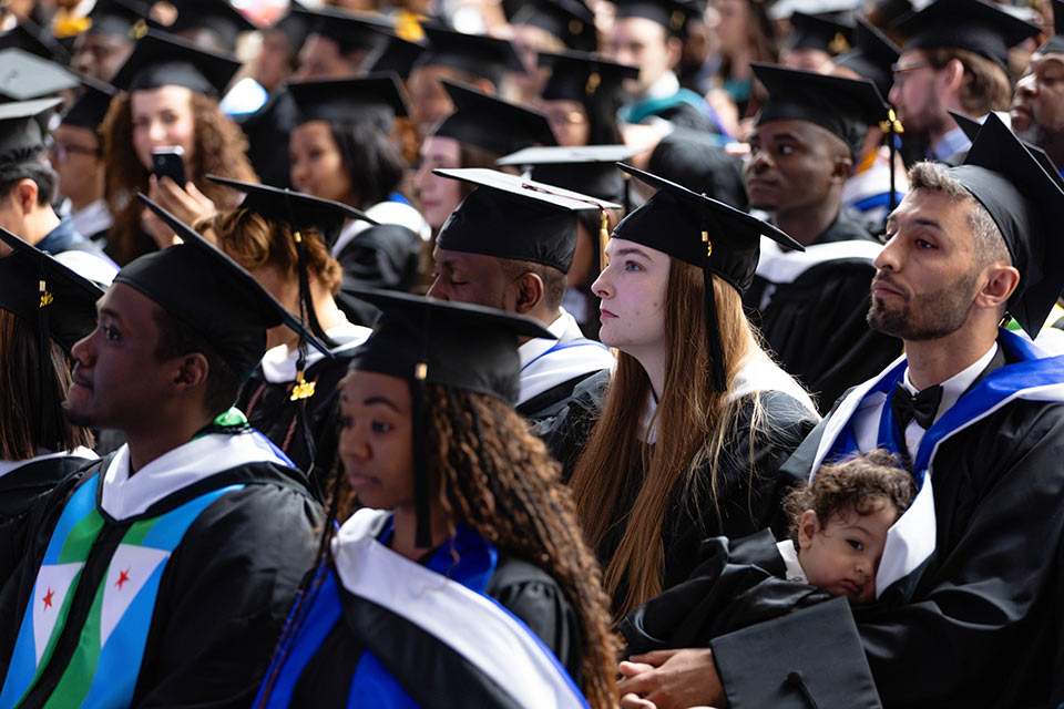 Students from the Brandeis International Business School celebrate at Commencement