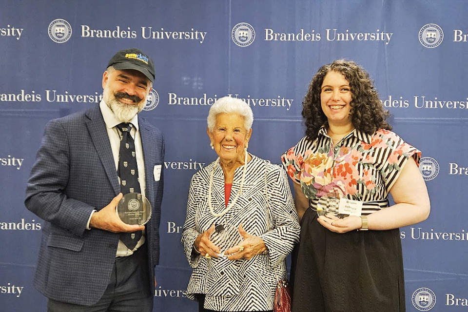 Three award winners together holding their awards
