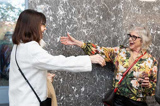 alumni reach out for an embrace