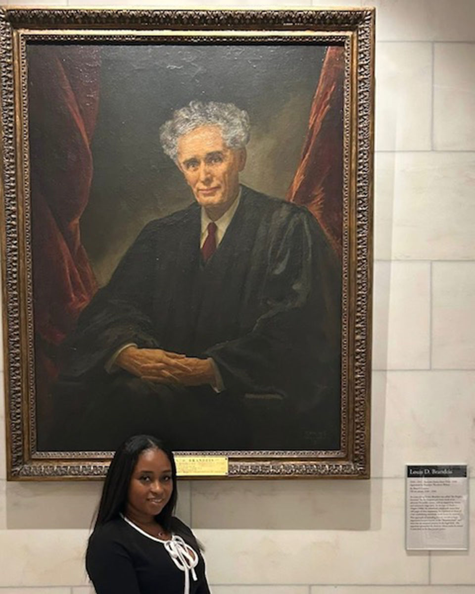 When Shakiva Pierre ’07 was sworn into the U.S. Supreme Court Bar this past December, she made it her mission to take a photo in front of the portrait of Justice Louis Brandeis.