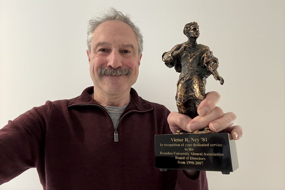 Vic Ney ’81, P’11, with the Justice Louis Brandeis statuette he received in recognition of his service to the Alumni Association.