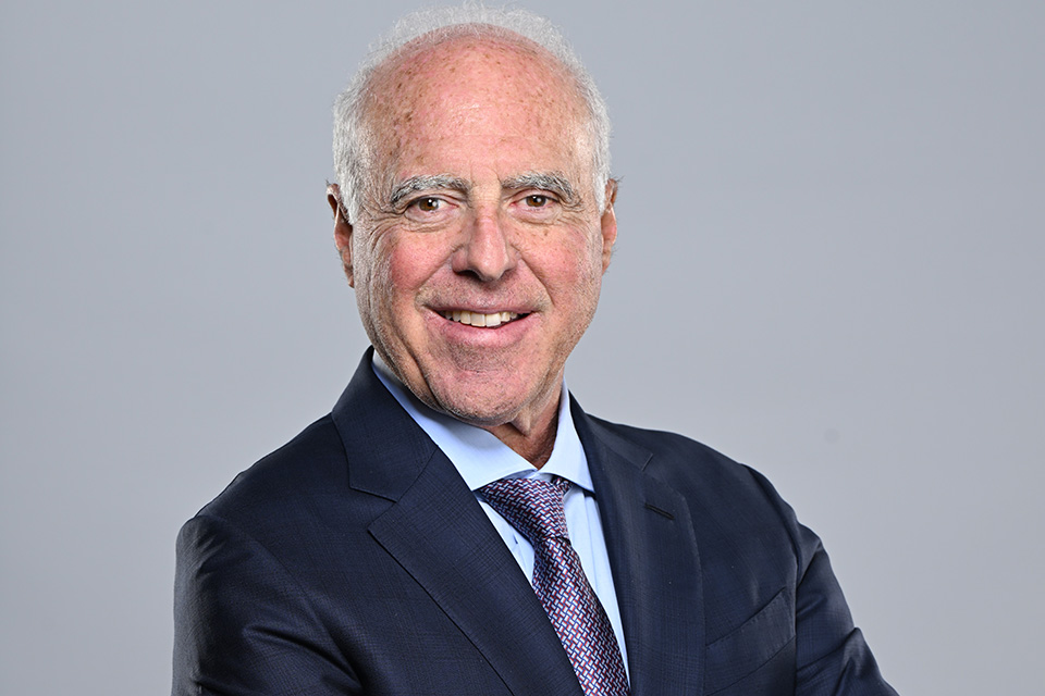 Jeffrey Lurie, PhD'87, in a blue business suit
