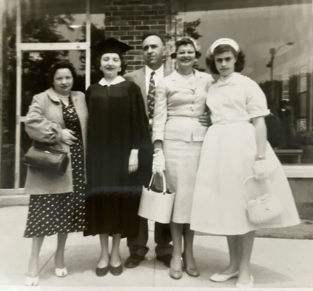 Joy Fish is shown with her family at her graduation.