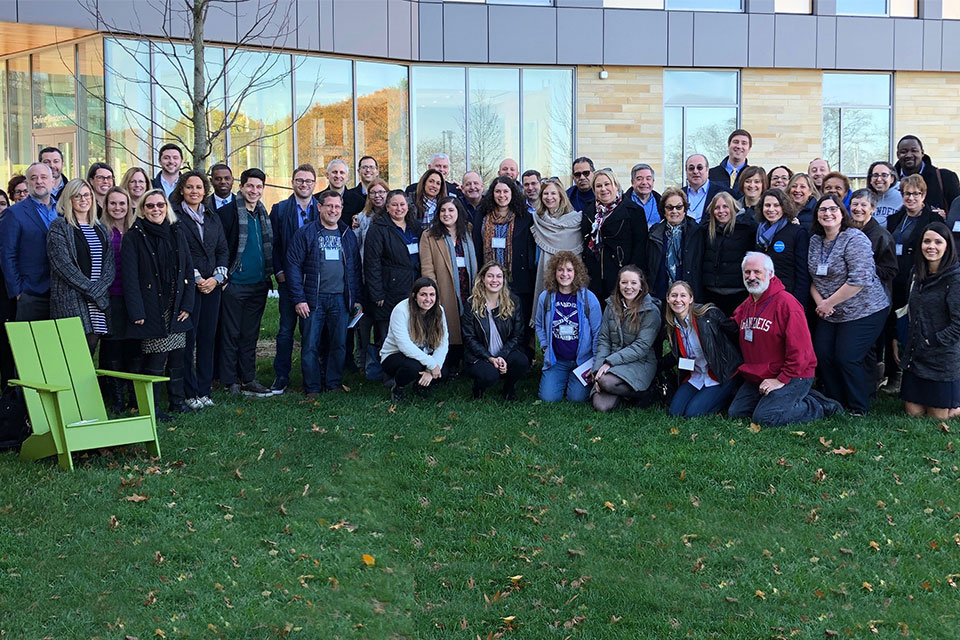 photo of alumni board on the lawn on campus 