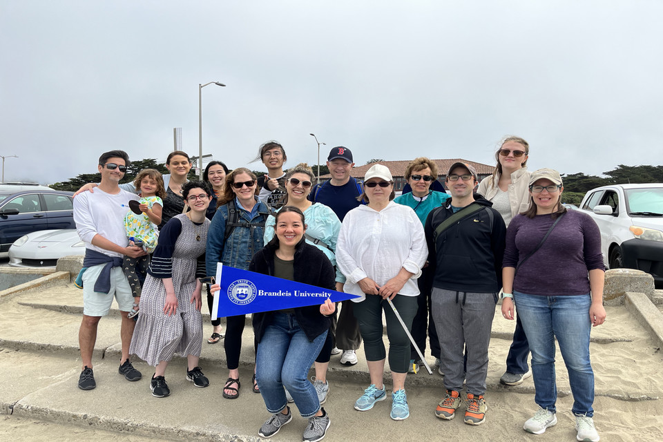 Brandeis group posing for photo after beach clean up event in Northern California