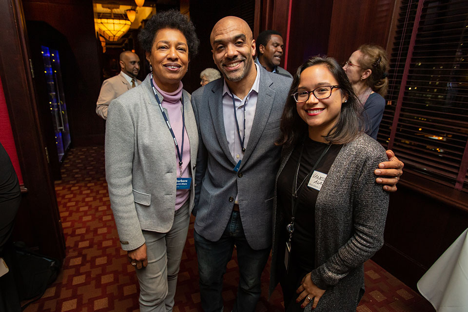 Three people at gathering in Atlanta