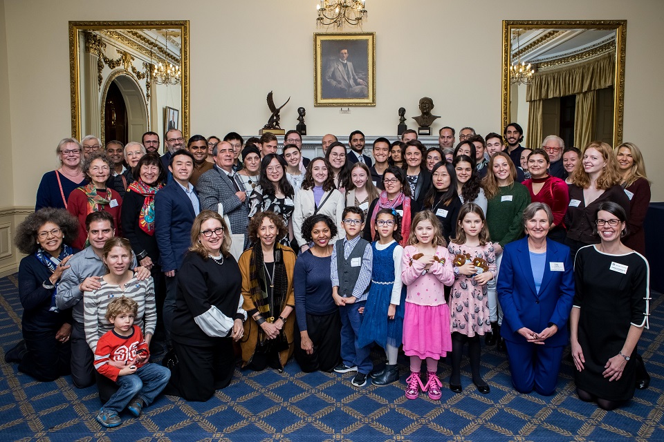 The 70-plus attendees at the Alumni Club of Great Britain’s Thanksgiving Tea in November 2019 pose for a group photo.