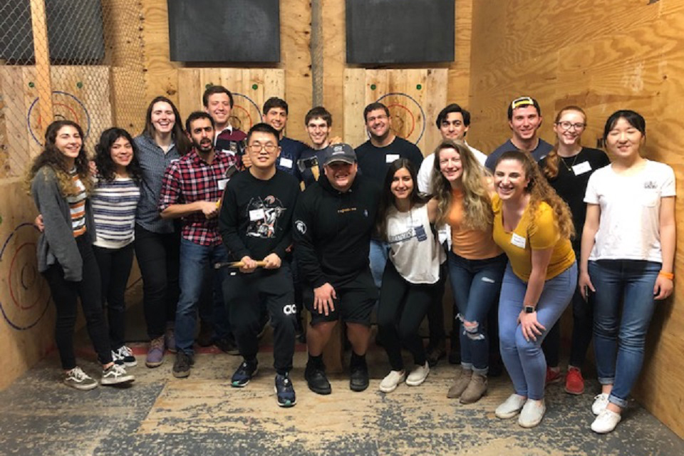 Participants at the axe-throwing event pose for a group photo in April 2019.