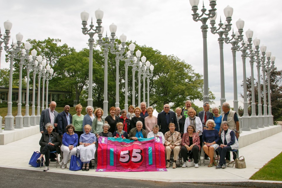 Members of the Class of 1955 gather in front of the Lights of Reason during their 60th Reunion at Brandeis.