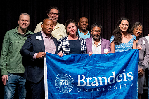 Brandeis students on stage during a play.