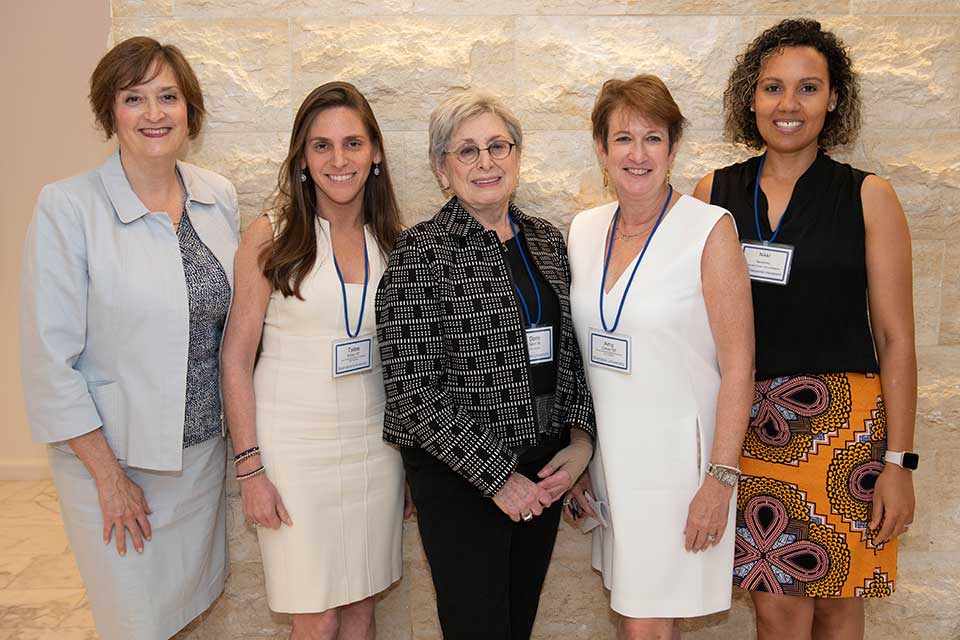 Five women from the Brandeis Women's Network smiling at the launch event