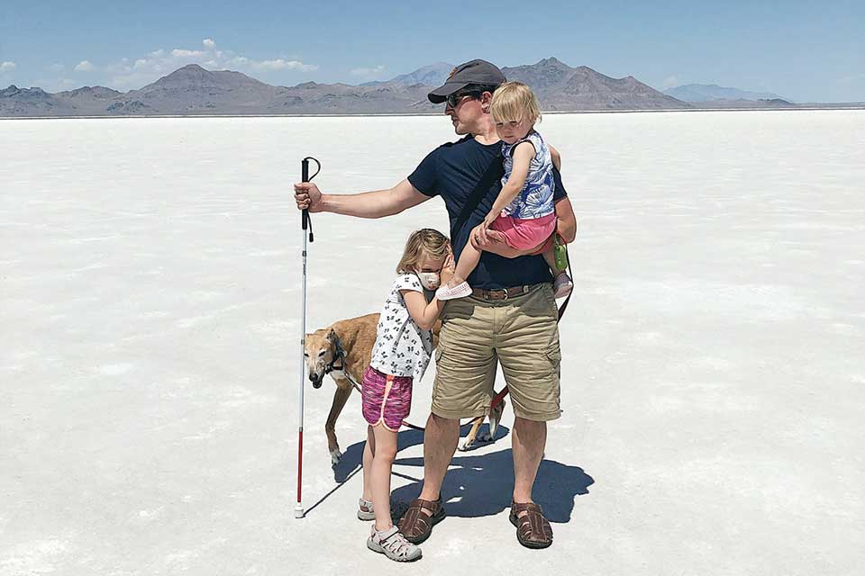 Eric J Harvey with his two young children in the Utah salt flats 