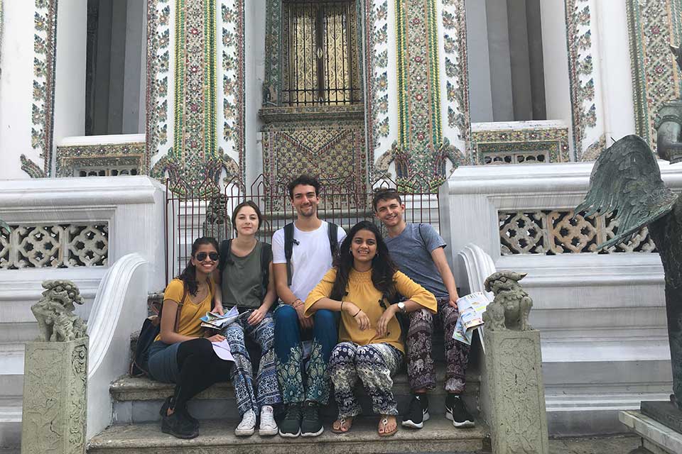 Khushee Nanavati on steps on temple in Bangkok with friends 